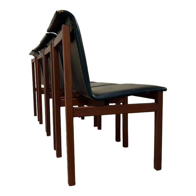 Beautiful set of rosewood dining chairs made in Finland with a sculptural curved back. They bear some resemblance to Tobia...