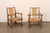 A handsome pair of Spanish wooden armchairs, with rush seat and backs, from the mid 20th century. This mid-century pair of...