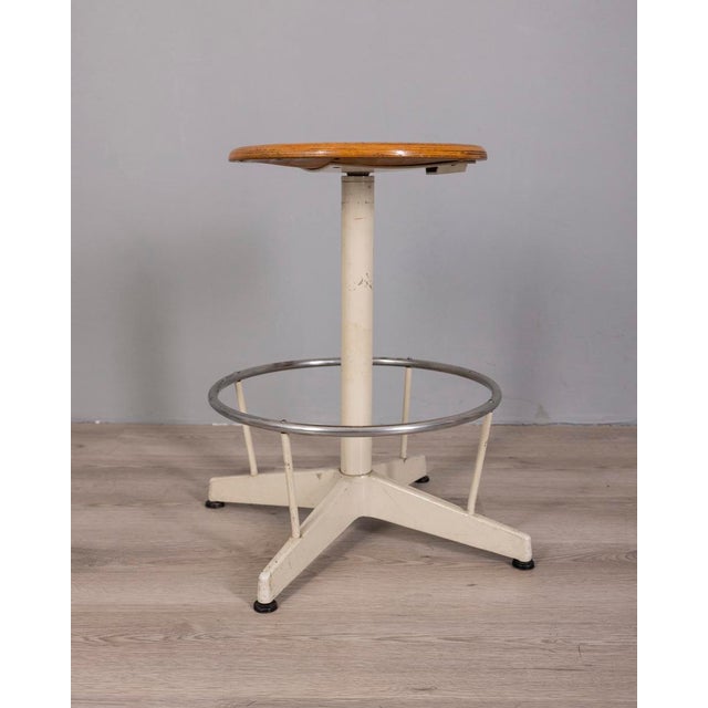 Stool with white and chrome metal frame, adjustable wooden seat, made in Italy in the 1960s, industrial design.