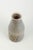 Carl-Harry Stålhane (1920–1990) for Rörstrand. Cylindrical stoneware vase with brown glaze and incised geometric pattern...