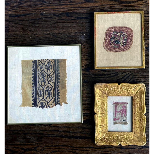 A collection of three antique textile fragments displayed in various frames from an estate collection in US. It consists...