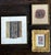 A collection of three antique textile fragments displayed in various frames from an estate collection in US. It consists...