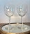 An exquisite pair of crystal glasses in the elegant balloon-shaped model by baccarat, crafted in france prior to 1936. As...