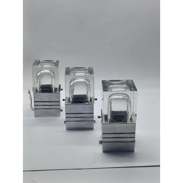 Set of three original ceiling lamps designed and created by Gaetano Sciolari for the Sciolari company in the 1970s. The...