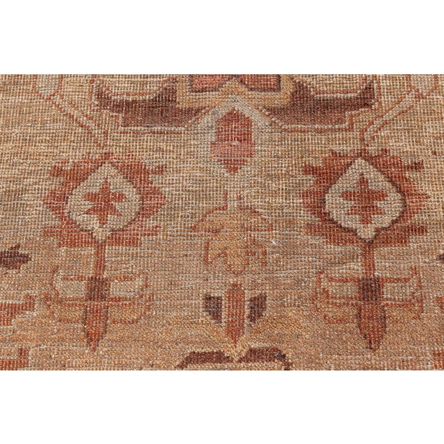 Antique Indian rugs often include large scale patterns depicting mythical beasts and Persian-inspired floral motifs....
