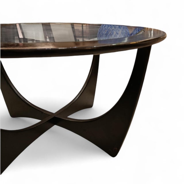 An icon of 1960s English design. Crafted from black lacquered wood and designed by Victor Wilkins for G-Plan in a highly...