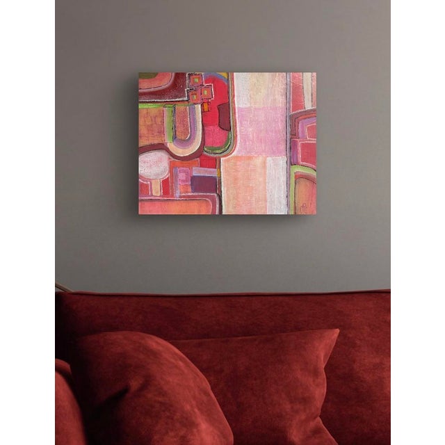 Complex geometric patterns in a spectrum of reds and pinks, accented by acid green and lavender, make up this versatile...