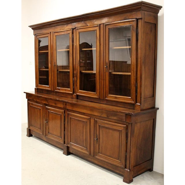 Important Empire library with 8 doors. In solid walnut. First half of 800 era - Restoration period. Measures: width 296...