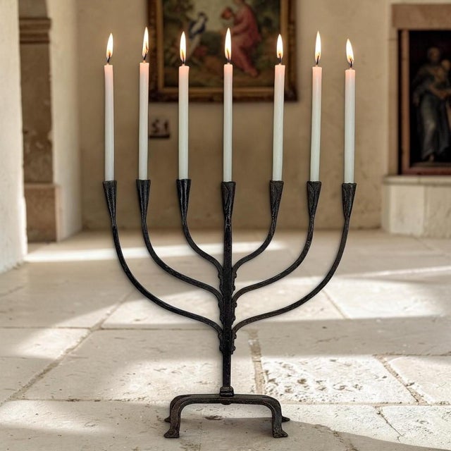 Bold yet beautifully balanced, this mid-century French candelabrum was hand-forged from iron in the expressive Brutalist...