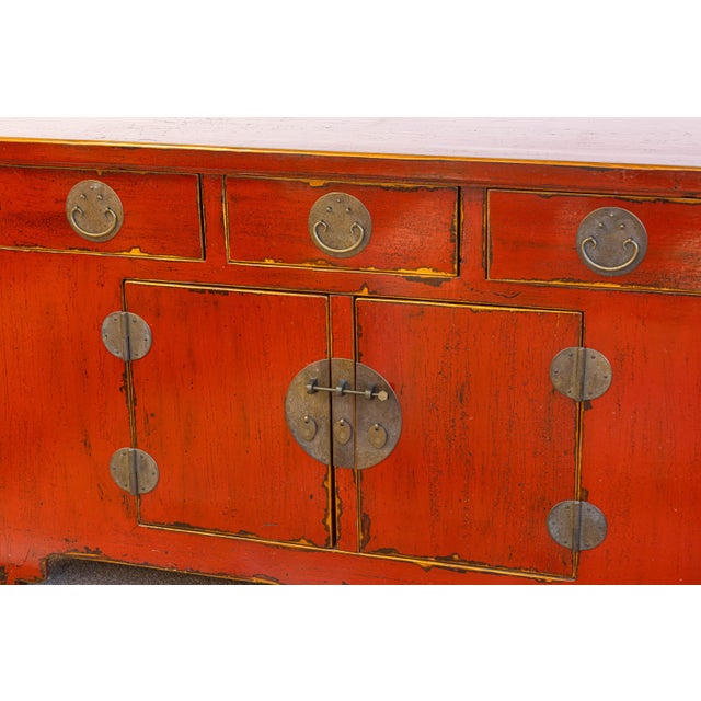 A vintage Asian sideboard buffet cabinet. This gorgeous cabinet features a classical alter table design with sculpted wood...