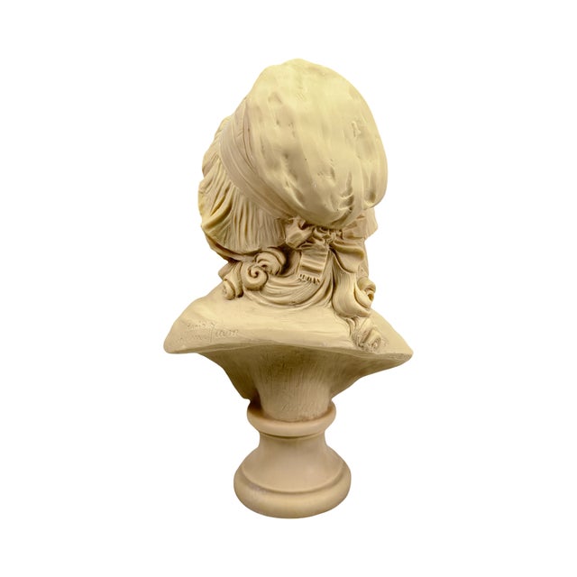 Lovely antique bust/statue of a young French girl with bonnet. Made from a composite resins and plasters. Signed by Artist...