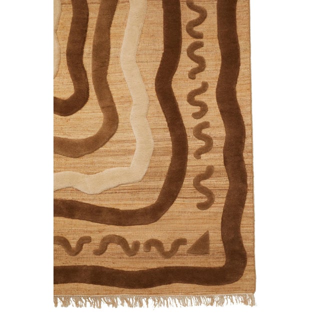 Flat weave rug in a blend of hemp and jute, with 100% hand-knotted New Zealand wool shag pile overlay. Designed for an...