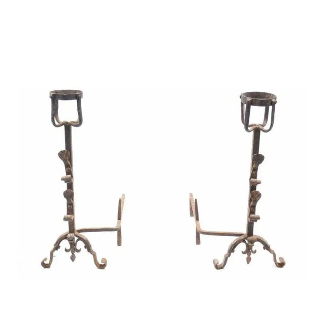Antique French hand forged wrought iron andiron pair, basket style tops, fleur-de-lis lower finial, split from the solid...