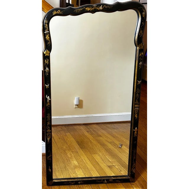 Discover the timeless elegance of this exquisite vintage Chinoiserie wall mirror, masterfully crafted by Friedman Brothers...
