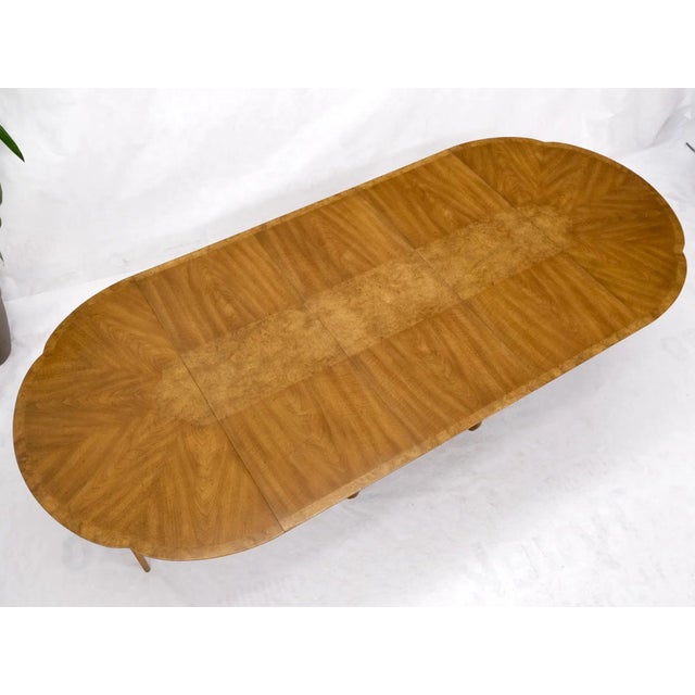 Round clove shape burl walnut dining conference table w/ 3 x 20" extension leaves. Extends to maximum of 108" long.