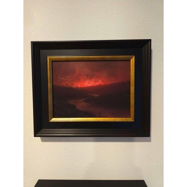 The painting captures a dramatic sunset over a meandering river, where vibrant reds and deep oranges dominate the sky,...