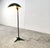 Vintage floor lamp made from dark green metal. It has a nicely shaped shade and a tripod base. It can be used in and...