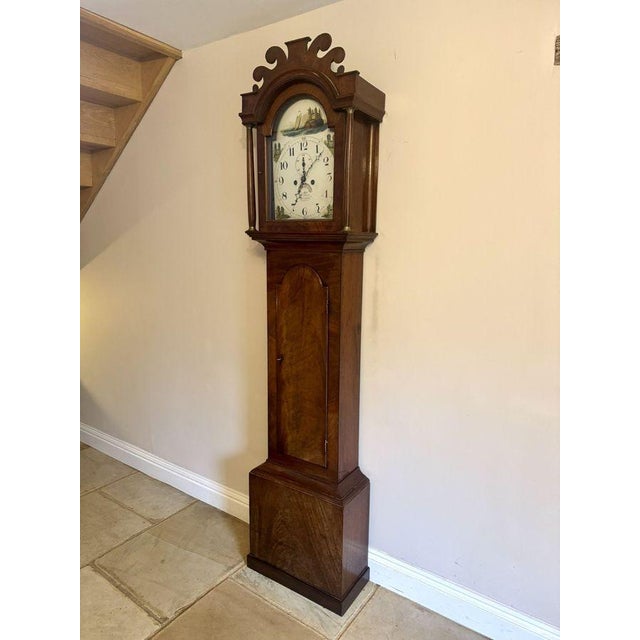 Quality antique George III mahogany arch dial long case clock, having a quality antique George III mahogany long case...