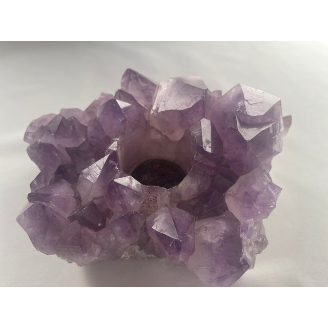 Natural large amethyst crystal cluster votive candle holder has a wonderful illumination and is interesting to look at...