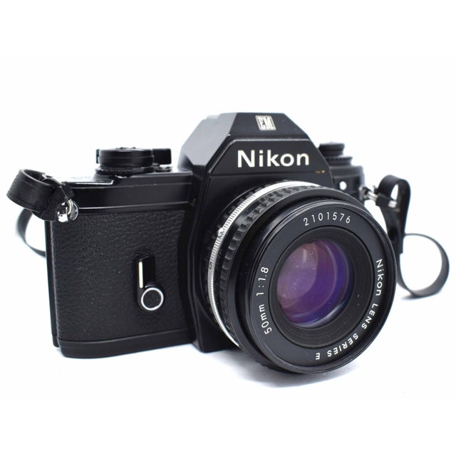 Capture a classic aesthetic with this complete Nikon EM 35mm film camera kit, a celebrated piece of mid-century Japanese...