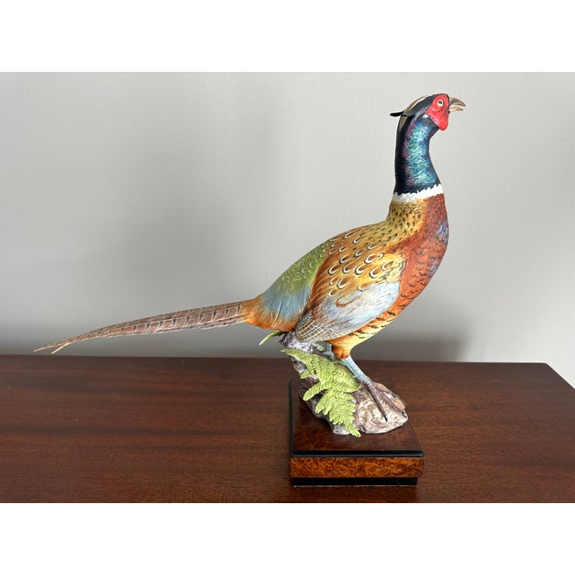 This exquisite piece of artwork portrays a lifelike representation of a ring-necked pheasant, meticulously crafted in...