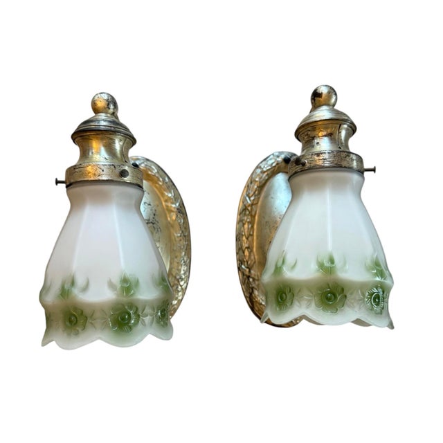 Really great early 20th century wall sconces feature all original silverplate with great patina. The original shades are...