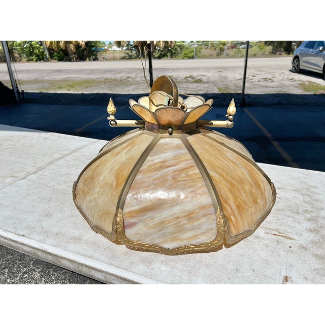 Vintage Slag Glass Lamp Eight curved Slag Glass panels with metal overlay. The inside bottom of the shade has a white...