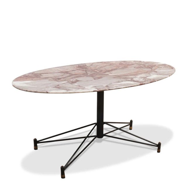 A striking example of mid-century Italian design, this Osvaldo Borsani–style coffee table pairs sculptural restraint with...