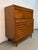 Iconic “Dania” highboy dresser designed by Merton Gershun for American of Martinsville. A standout example of Mid-Century...