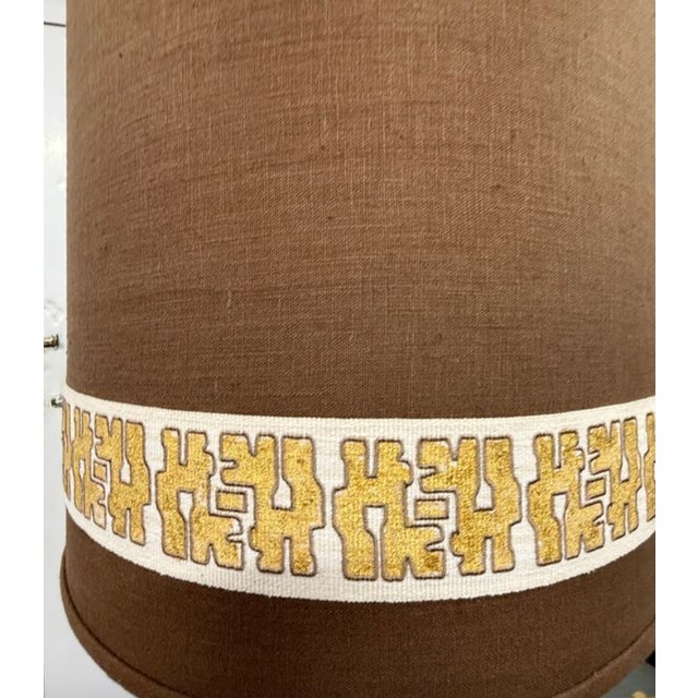 Ornate ceramic lamp with drapery detail, and custom sienna linen shade by Michael Savoia