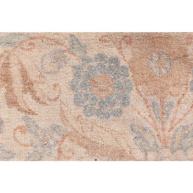 This circa-1920 antique Persian Tabriz carpet features an all-over design of floral abstractions, arabesques, palmettes,...