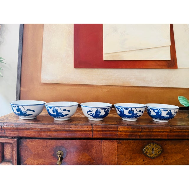 A striking set of five vintage Chinese blue and white porcelain scholar bowls decorated with traditional figural scenes of...
