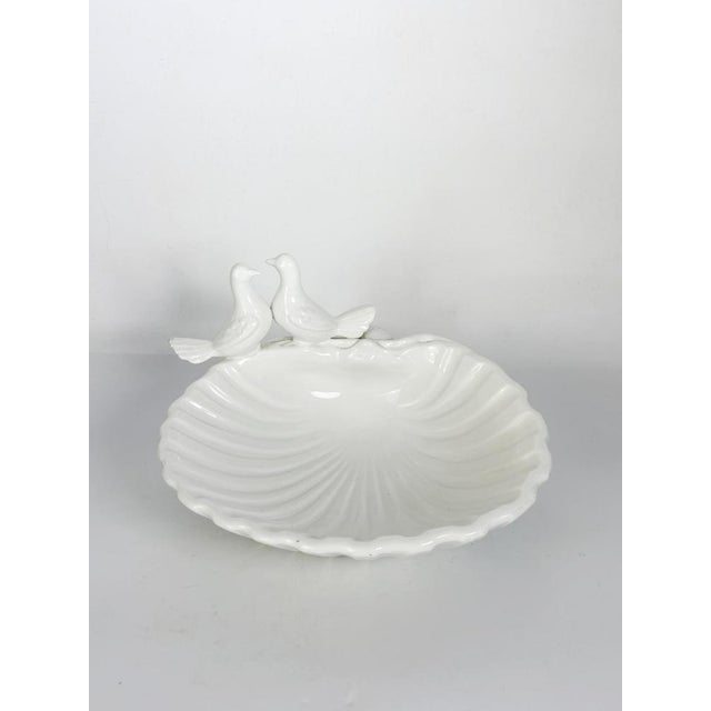 Elegant French ceramic catchall dating from the 1960s, beautifully modeled as an open seashell with two perched doves...