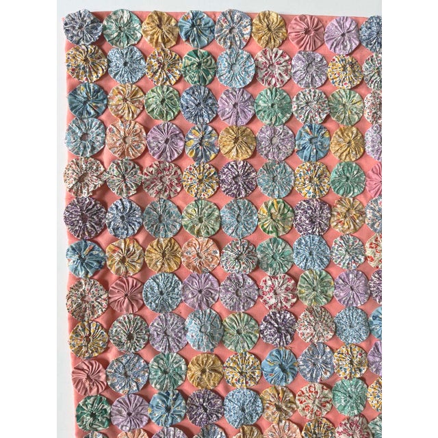 Yo-yo quilts are a true labor of love to create. This is a one-of a -kind decorative quilt top was hand made using printed...