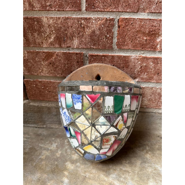 A striking and deeply personal example of 19th-century “memory ware,” this handcrafted wall pocket is composed of...