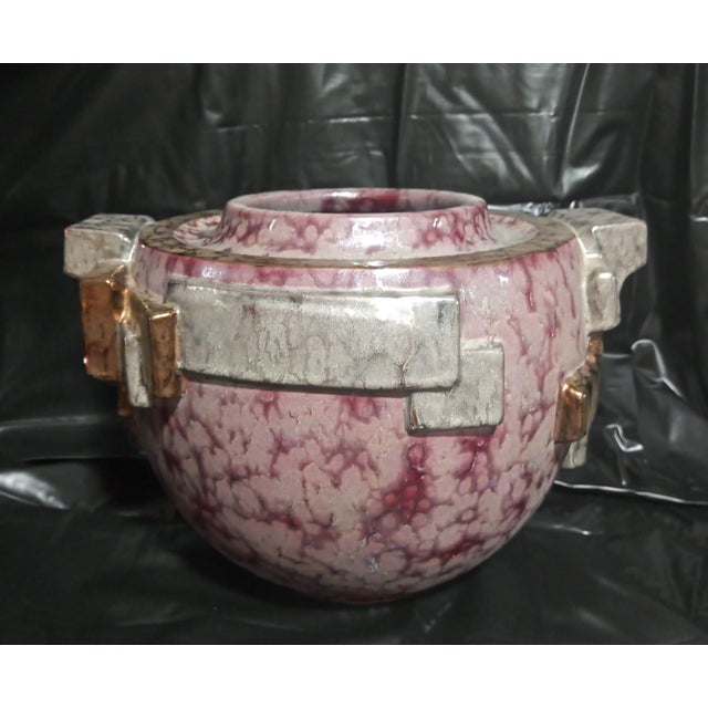 Decorative vase in the "Art Deco" style. Hand-painted decoration using precious metals. with its original wooden base....