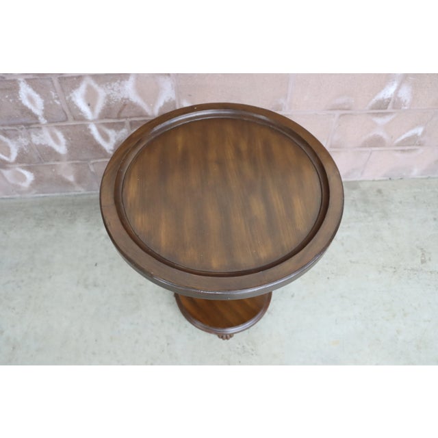 Tilt top circular accent table with pineapple carved base. 36" tilted height