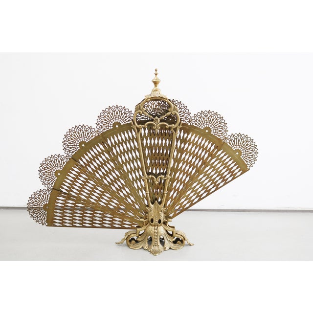 French Fan-Shaped Fire Screen Fire Screen / Spark Guard Brass France, 20th Century In the shape of a peacock Elegantly...