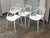 Design Plus Gallery presents a Set of Four Masters Style Dining Chairs. Defined by an interwoven openwork back and fluid...
