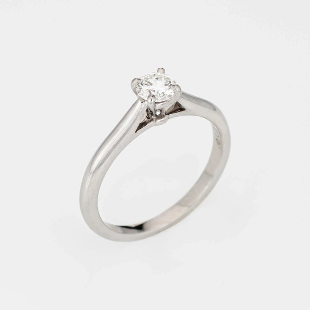 Estate Cartier diamond engagement ring crafted in 950 platinum (circa 2001). The ring is set with a 0.30 carat round...