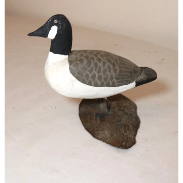 Up for sale is a wonderful antique 19th century hand carved miniature wooden goose decoy sculpture. It's completely carved...