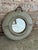 Vintage ceramic round wall mirror, featuring a unique speckled glaze over a pale green glazed base with textured side...