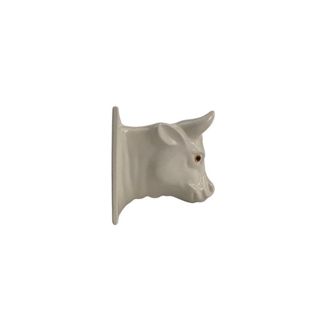 20th century country ceramic decorative towel holder in the shape of a cow head. Two holes for mounting. 4” H x 3 1/2” W x...