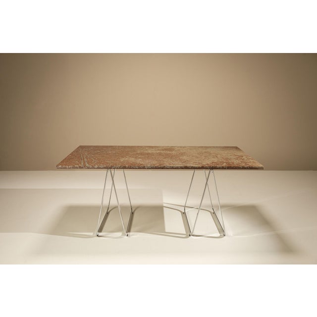 A quiet balance between weight and lightness defines this table. The composition draws from architectural restraint, where...