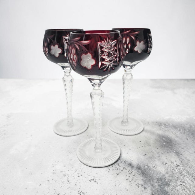 This Ajka Crystal Marsala Hock wine goblet was hand-blown and hand-cut in Hungary during the late twentieth century....