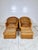 Vintage pair of Wicker Works style lounge chairs with matching ottomans. Rattan and wicker frames with braided wicker...