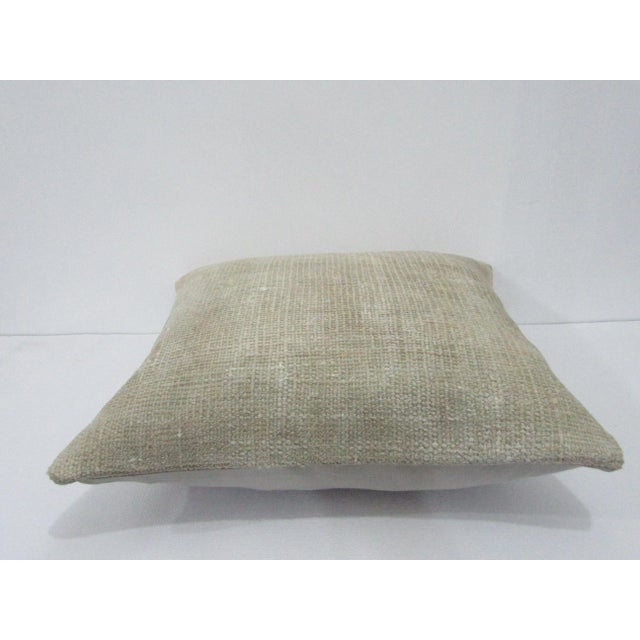 Decorative pillow cover made from a vintage Turkish handknotted rug. Backed with good quality cotton fabric. Pillow...