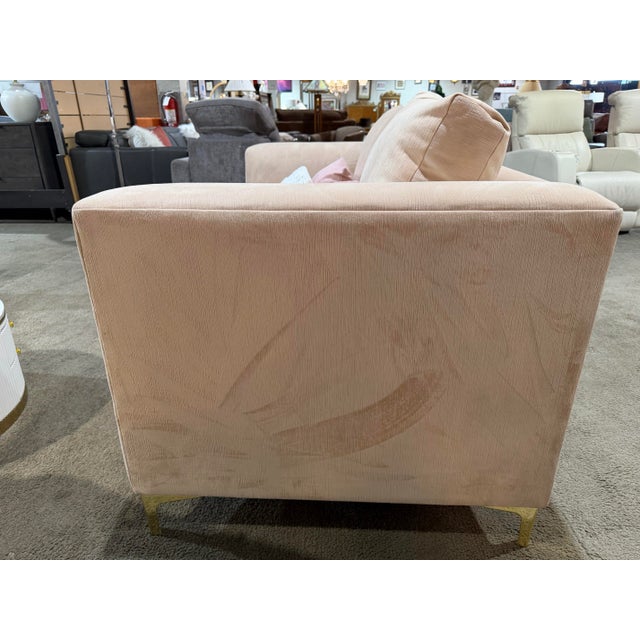 A chic blend of soft color and modern form, this contemporary pink loveseat brings both style and comfort to any living...