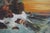 Vibrant antique landscape of a vibrant sunset with rugged waves and rocks in foreground beautifully framing sunset. Circa...