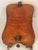 Antique Moroccan Camel Saddle Leather Footstool With Bronze Bell For Sale - Image 4 of 5